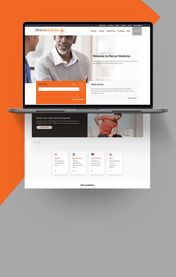 Open laptop displaying web pages and graphics for the Mercer Medicine website