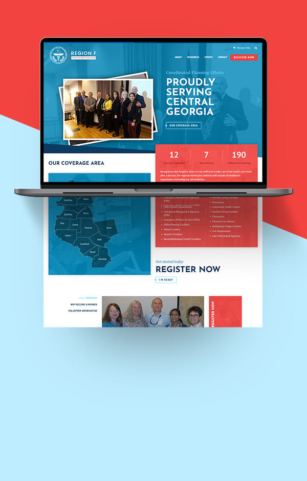 Open laptop displaying Region F Healthcare homepage designs