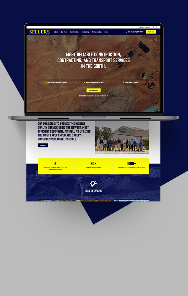Open laptop displaying web pages and graphics for the Sellers Construction website